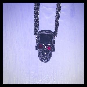 Skull necklace with red eyes
